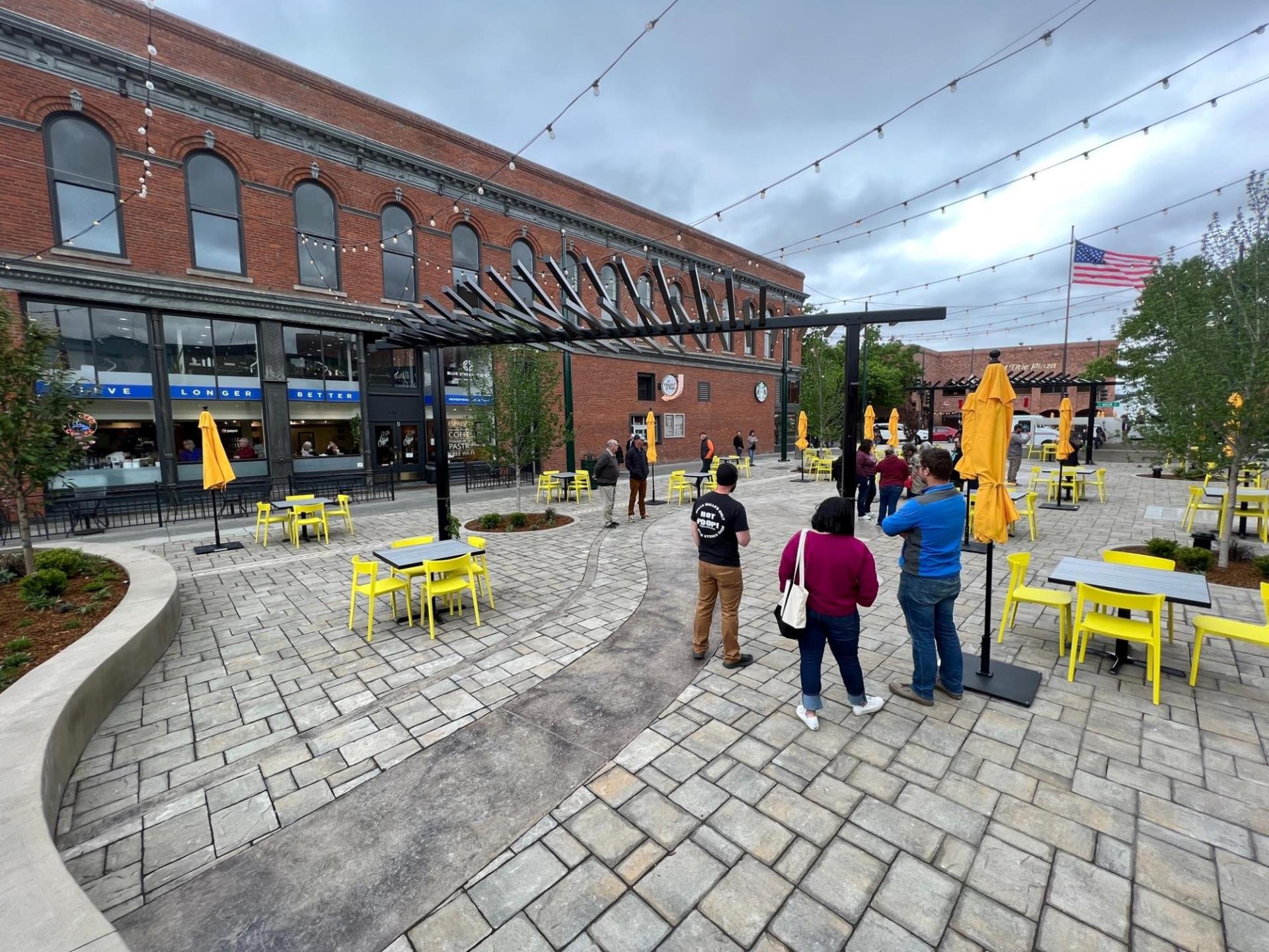 Walawála Plaza viewed from the southeast, with people standing on the pavers